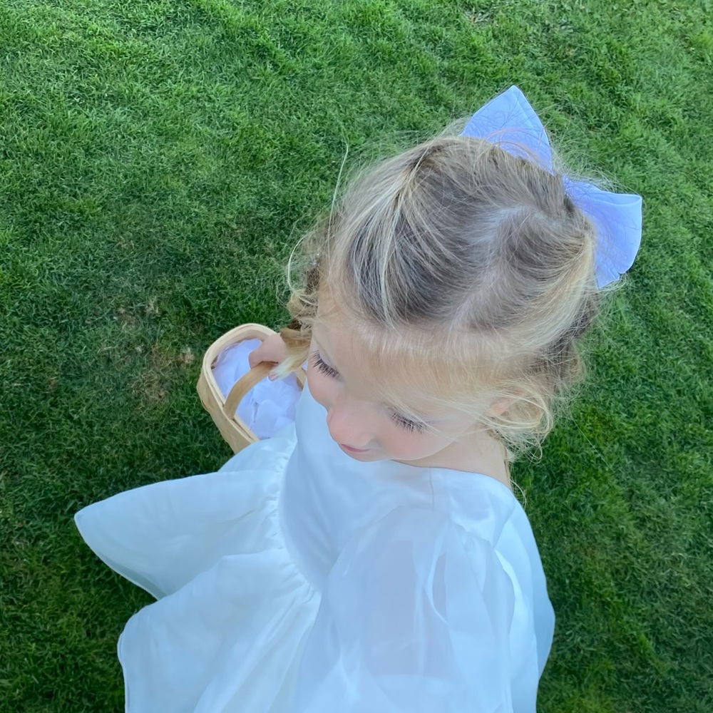 Flower girl Dress is white. I have couple sizes available. Size 2t, 3-4T, 5-6T